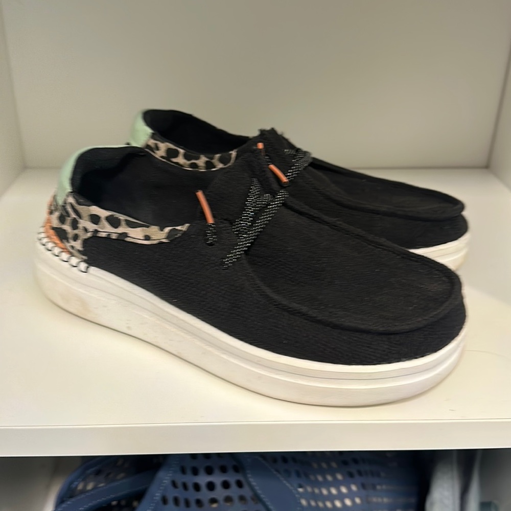 Hey Dude black with cheetah print size 8.  Only worn a couple times